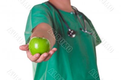 Doctor with a green apple on his hand