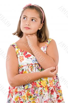 Adorable girl with flowered dress thinking