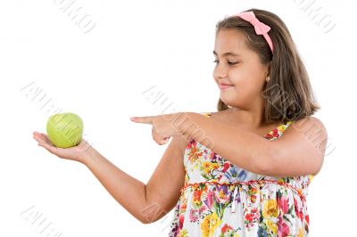 Adorable girl with flowered dress with a apple