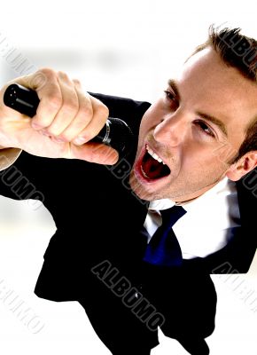 young man singing into microphone