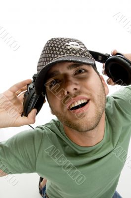 male holding headphone