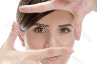 beautiful woman showing framing hand gesture