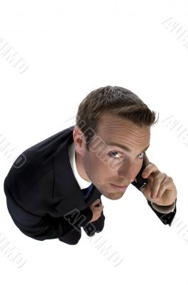 businessman busy on phone call and looking upwards