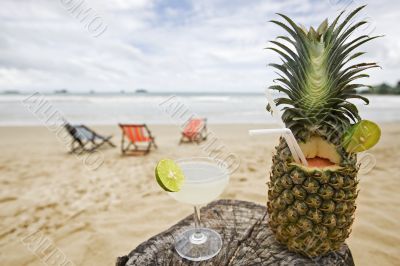 Pineapple, cocktail on the beach