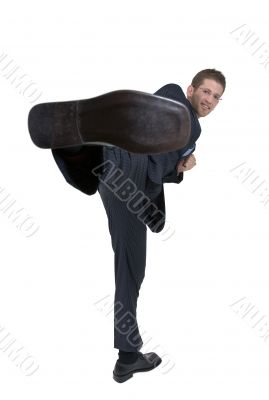 kicking businessman