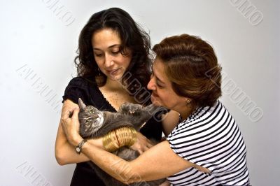 Ladies holding cat