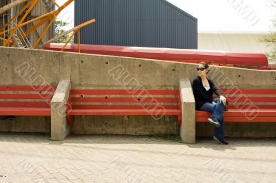 Woman on red bench