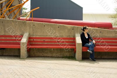 Woman on red bench