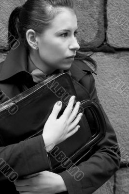 woman in black holding portfolio