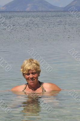 Swimming elderly woman
