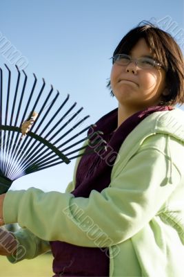 Girl Raking Leaves