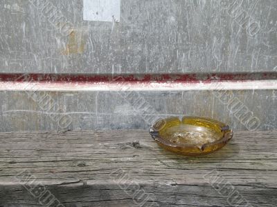 brown ashtray on a bench