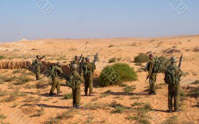 Israeli soldiers excersice in a desert