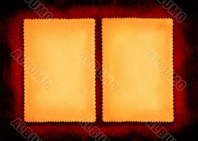 two pieces of yellowed paper on red