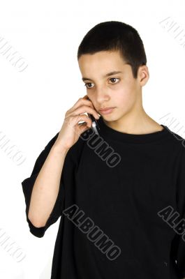 teenage boy in a serious conversation on his mobile