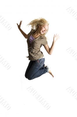 jumping teenage girl is having lots of fun