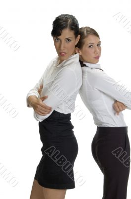 young women standing back to back