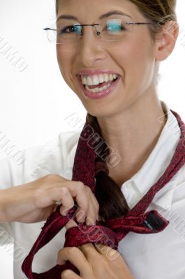 young happy woman tying her tie