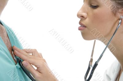 lady doctor examining the patient with stethoscope