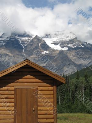 cottage at the foot of mountains