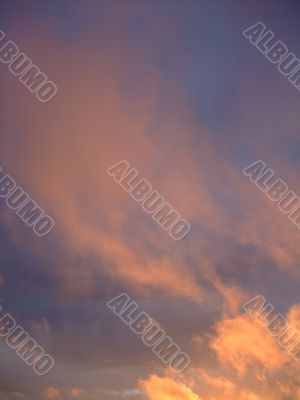 stratus clouds with orange reflection on sunset