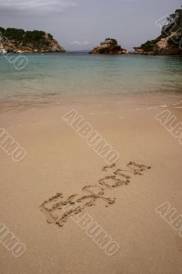 España written on a beach