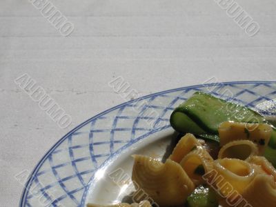 pasta dish on a blue and white plate