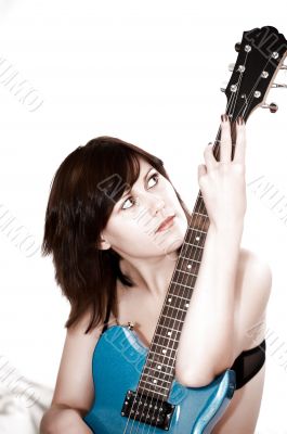 Young beautiful woman with guitar