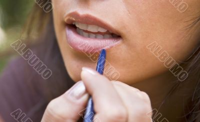 Applying lipstick