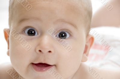 happy child lying and looking at camera