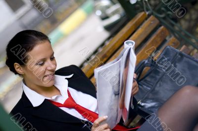 businesswoman reading magazine