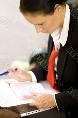 businesswoman is writing note
