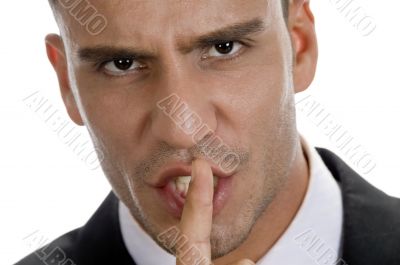 businessman shushing with close up pose