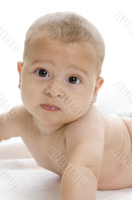 happy child lying and looking at camera