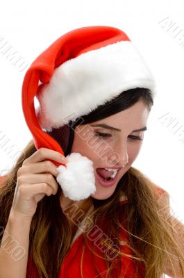 woman with santa cap and looking downward