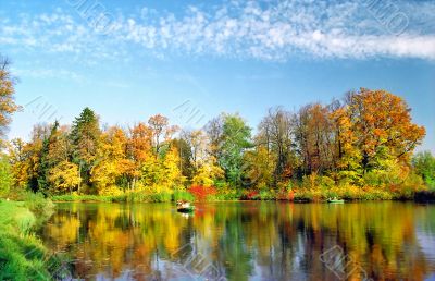 Lake with picturesque autumn trees