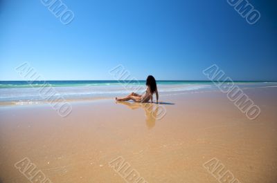 woman sitting at seaside