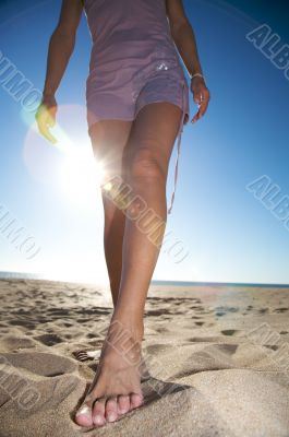 woman foot on the sand