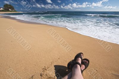 Man Relaxes on Tropical Shoreline