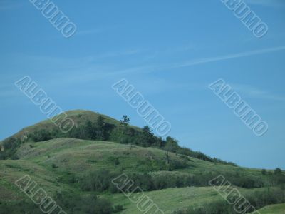 green hill and blue sky