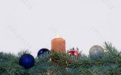 Branches of a blue spruce with Christmas toys