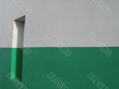door on a white and green building
