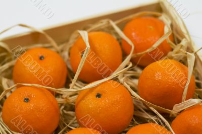 tangerines with straw