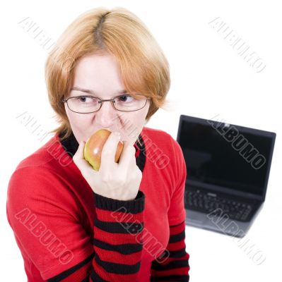 Woman bites an apple