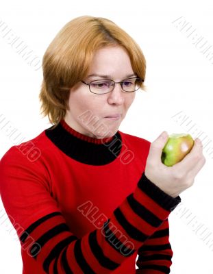The girl eats an apple
