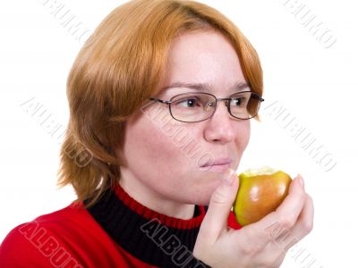 The girl eats an green apple