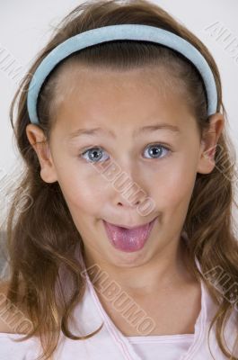 little girl showing her tongue