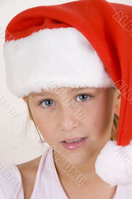 smiling little girl wearing christmas hat