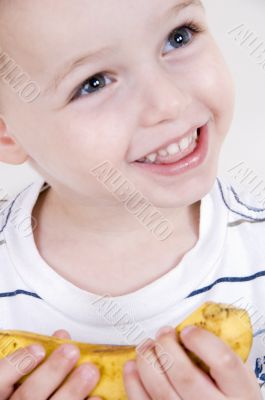 smiling boy with banana
