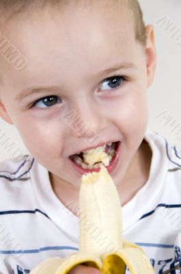 healthy boy eating banana